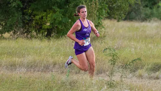 Grace White rounds the corner at the ACU Cross Country Course.