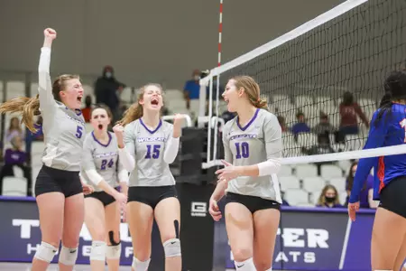 VB team celebrates after scoring against UTA