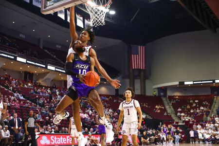 Reggie Miller goes up and under against the Aggies in College Station