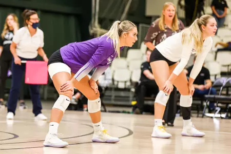 Madison Lawler lines up in serve receive at home against UTRGV