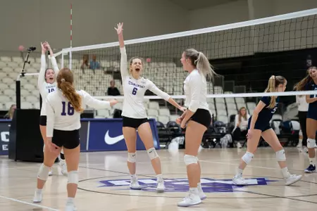Wildcats celebrate a point against CBU