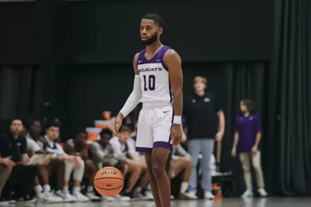 Reggie Miller brings the ball up the court against McMurry