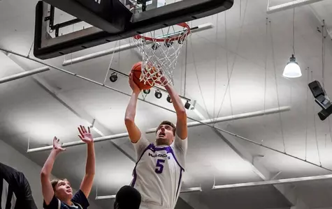 Cameron Steele drives the lane for a bucket against HPU