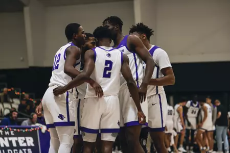 MBB huddles on the court against Drexel