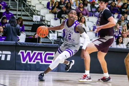 Mahki Morris drives to the basket in a MBB win over Schreiner