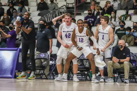 Wildcats bench celebrates in a win over AMCC