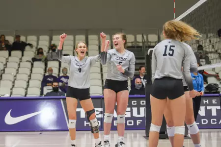 Wildcats celebrate a point against McNeese