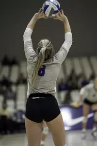 Sarah Nading sets the ball in a match against UTA