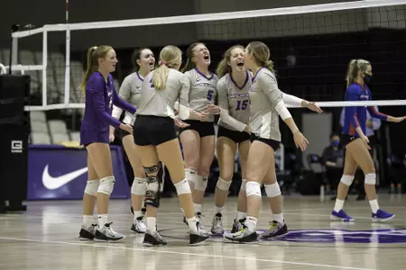 Wildcats celebrate a point against UTA