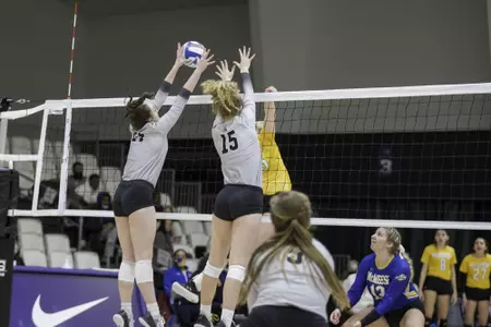 Braden Bossier and Kate Blasingame go up for a block against McNeese