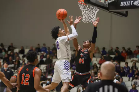 Coryon Mason drives to the hoop against Sam Houston at home