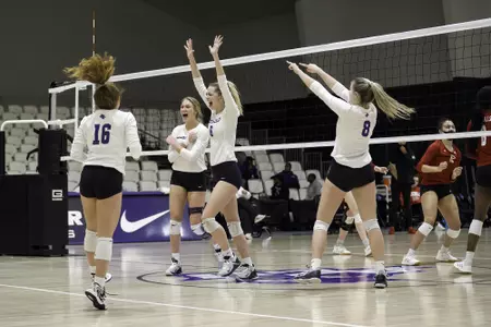 Volleyball celebrates a point against Nicholls