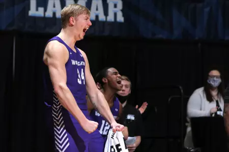 Kolton Kohl celebrates from the bench in the SLC Championship game