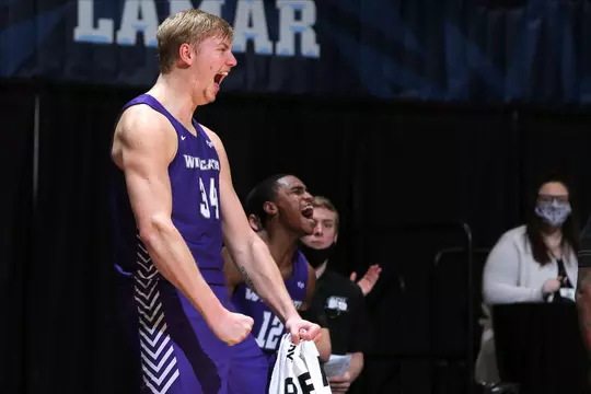Kolton Kohl celebrates from the bench in the SLC Championship game