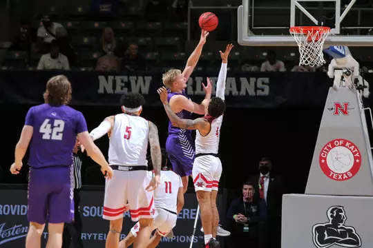 Kolton Kohl puts up a shot over Lamar defender in SLC semifinal