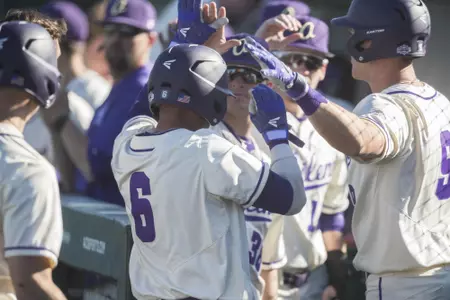 Alexei Cazarin is congratulated after scoring a run vs. Nicholls
