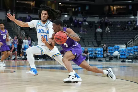 Damien Daniels drives the ball past a UCLA defender