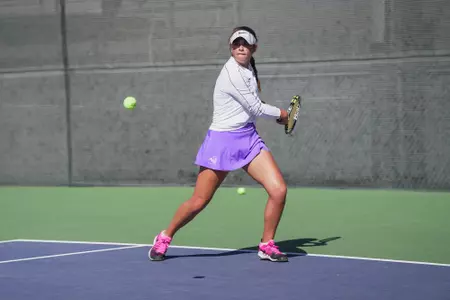 Allison Stewart returns a serve