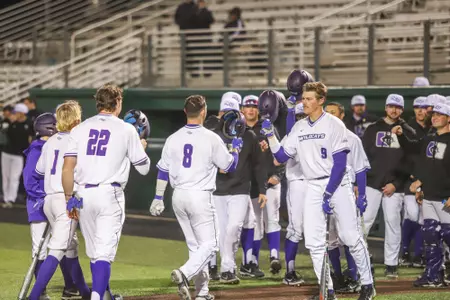 Colton Eager is congratulated at home plate vs. Arkansas State