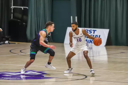 Reggie Miller brings the ball up the court against AMCC