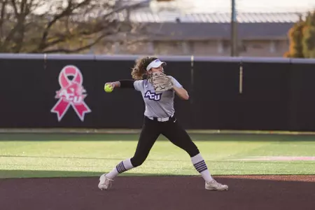 Val Rudd throws to first against UNT