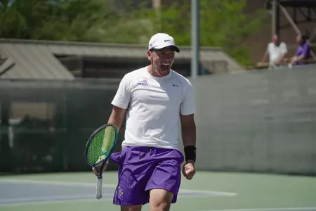 Riley Tran screams after winning a match point