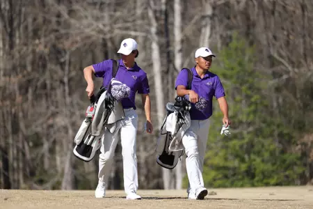 Francisco Osio (left) and Brian Choe walk the links at Pinehurst No. 8