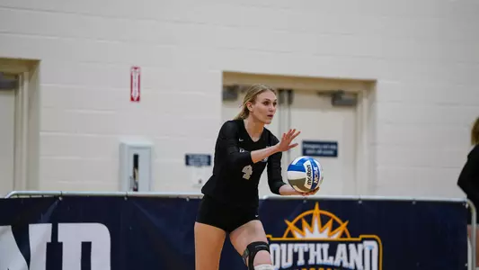 Kate Mueller serving at the SLC tournament