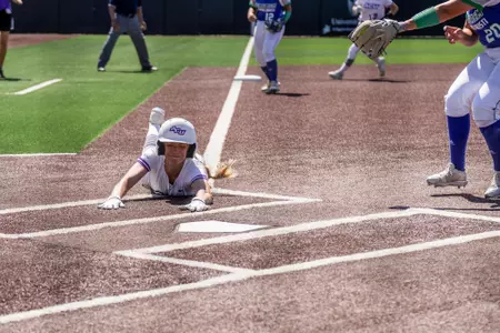 Caroline Adair slides into home on a passed ball