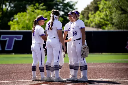 Infield huddles before an innings against AMCC