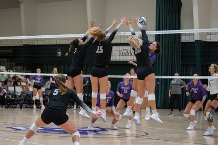 Birkel, Bossier, Toney go up for a block in the 2021 Purple/White scrimmage