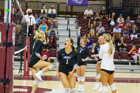 Wildcats celebrate a point against Oklahoma