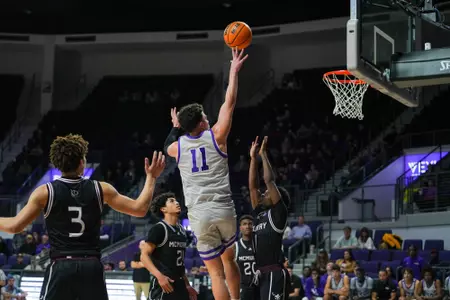 Tobias Cameron drives the lane for a bucket in a win over McMurry