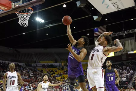 Immanuel Allen grabs a rebound against NMSU