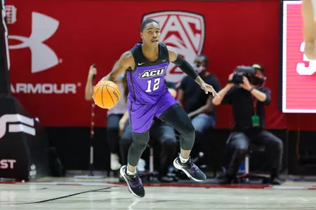 Mahki Morris brings the ball up the court at Utah