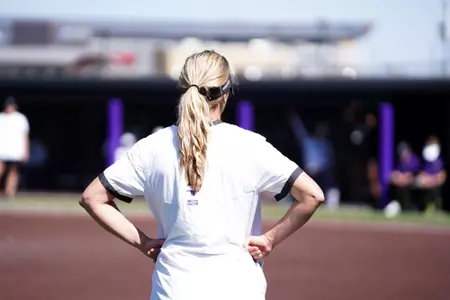 Abigail Farler coaching at third base