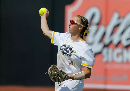 olivia taylor throws a ball from the outfield