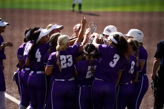 ACU SB huddles at the plate to celebrate a homerun in a win over texas tech