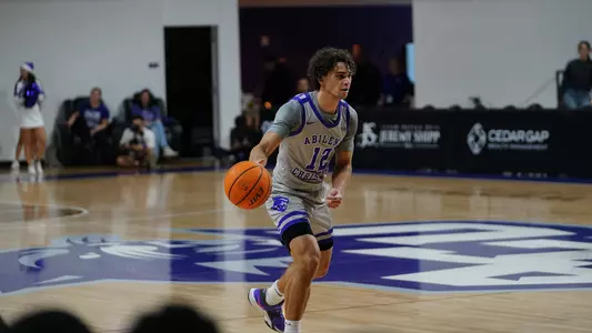 Hunter Jack Madden brings the ball up the floor in a game at Moody Coliseum