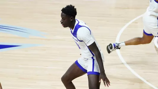 Ali Dibba defends at the top of the key in a game at Moody Coliseum