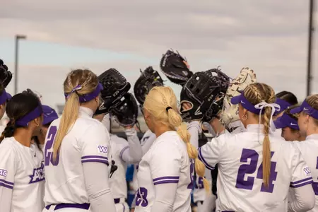 SB team huddle prior to game at Poly Wells Field