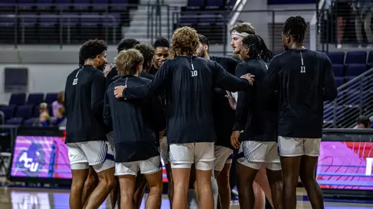 Men's Basketball Team Huddle