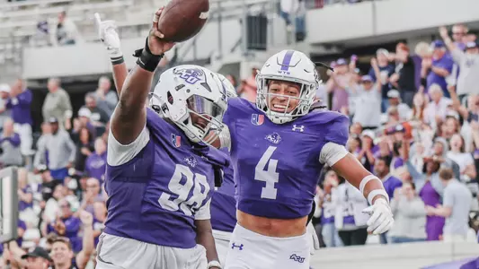David Oke and Tyson Williams celebrate a fumble recovery against Southern Utah on November 2, 2024