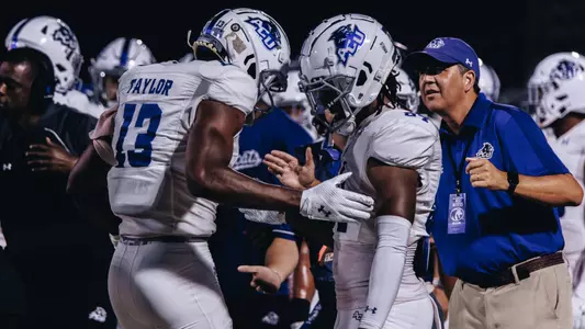 Blayne Taylor and Jacoby Boykins shake hands at Utah Tech