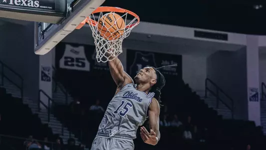 Bradyn Hubbard dunks against McMurry
