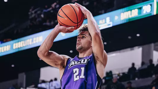 Hunter Jack Madden shoots a long shot at Baylor.