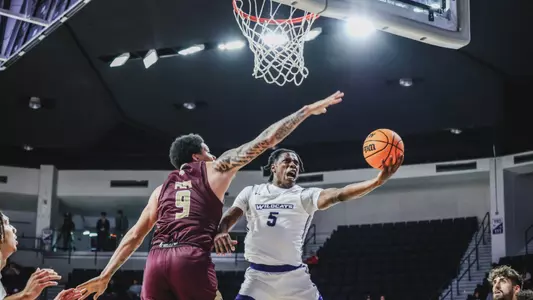 Quion Williams drives to the basket versus Texas State in November 2024