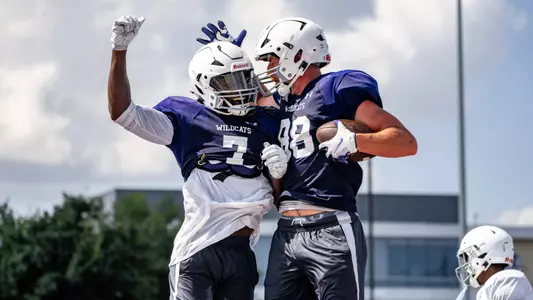 Trey Cleveland and Jed Castles celebrate during a practice