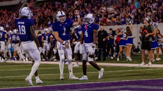 Maverick McIvor and Blayne Taylor celebrate with J.J. Henry vs. Idaho on Sept 21, 2024
