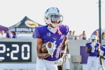 J.J. Henry warms up before ACU plays Idaho on September 21, 2024